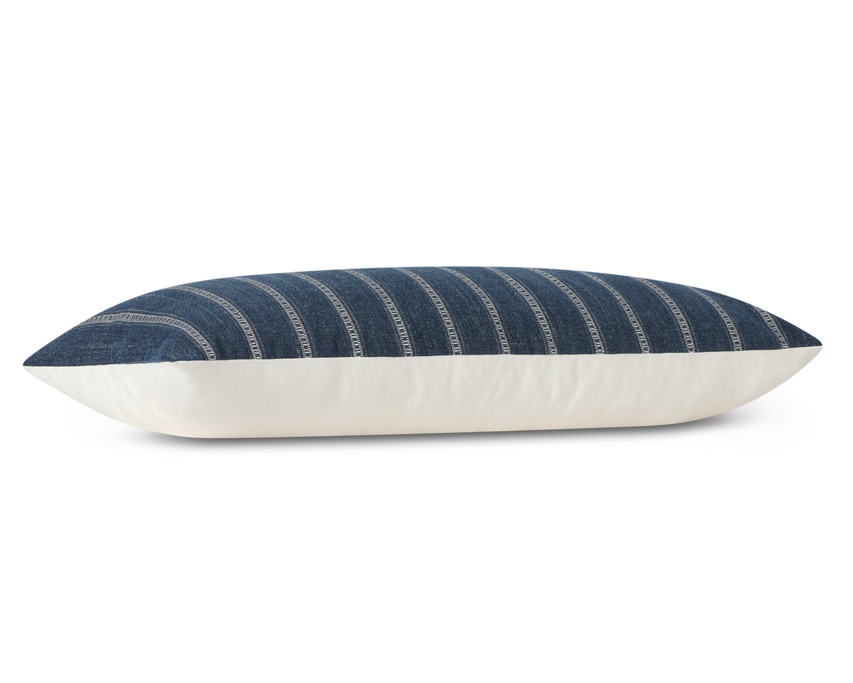 Taos in Indigo long lumbar pillow cover laid flat, deep indigo blue with ivory ladder stripes