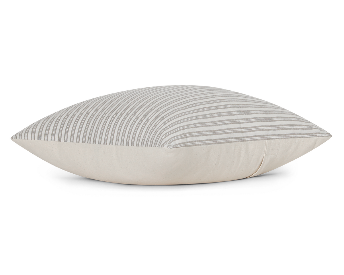 Flax and ivory ticking stripe cotton pillow cover, side view showing the cream cotton back