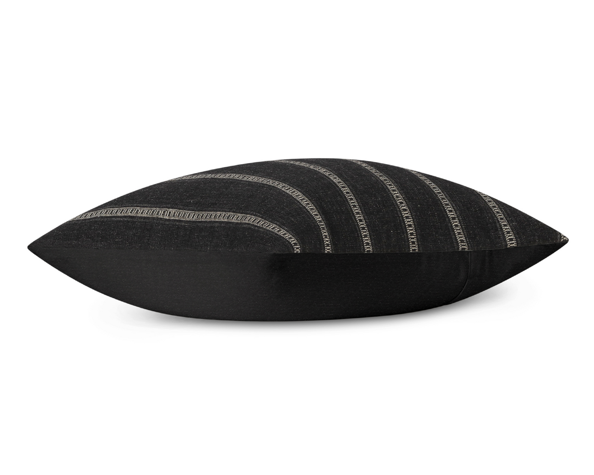 Taos in Onyx pillow cover laid flat, charcoal black with khaki ladder stripes and a black cotton back