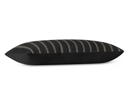 Taos in Onyx long lumbar pillow cover laid flat, charcoal black with khaki ladder stripes and a black cotton back