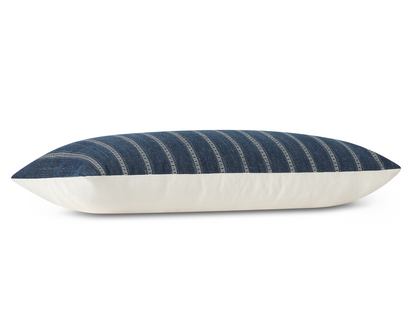 Taos in Indigo long lumbar pillow cover laid flat, deep indigo blue with ivory ladder stripes
